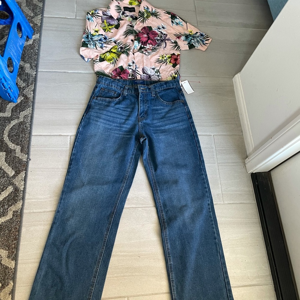 Relaxed fit jeans and Hawaiian shirt.